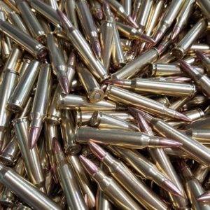 Loose remanufactured rifle ammo pile.