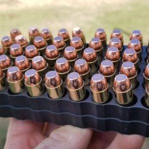 10mm Pistol ammo in a inside of an ammo tray with the points facing up.