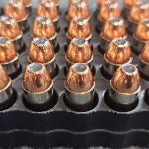 10mm 180 gr. XTP Hollow Point bulk remanufactured pistol ammo sitting in ammo trays point up.