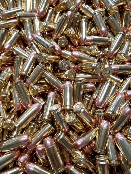 40 Caliber S&W bulk remanufactured ammo in a loose pile. Manufactured by Ammo by Pistol Pete