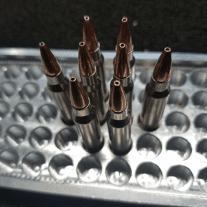 8 rounds of 223 Rem 75 grain Boat Tail Hollow Points Remanufactured Bulk Rifle Ammo in an ammo tray, manufactured by Ammo by Pistol Pete