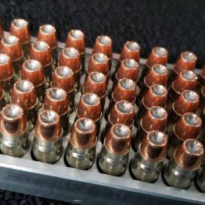 .357 Sig 125 grain Hollow Point remanufactured pistol ammo sitting in an ammo tray. Made in the USA by Ammo by Pistol Pete.