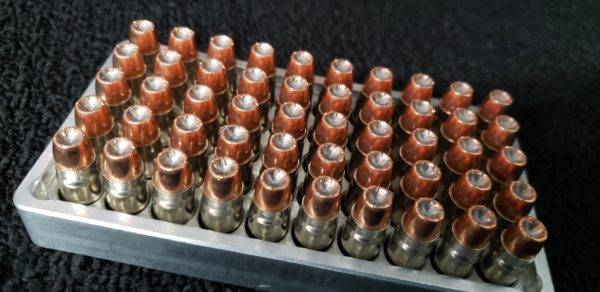 .357 Sig 125 grain Hollow Point remanufactured pistol ammo sitting in an ammo tray. Made in the USA by Ammo by Pistol Pete.