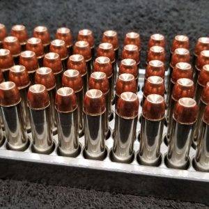 357 Magnum 158 grain Jacketed Hollow Point remanufactured pistol ammo sitting in an ammo tray nose up. Made in the USA by Ammo by Pistol Pete
