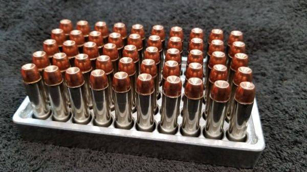 357 Magnum 158 grain Jacketed Hollow Point remanufactured pistol ammo sitting in an ammo tray nose up. Made in the USA by Ammo by Pistol Pete