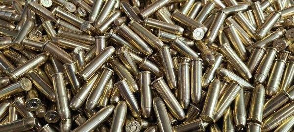 Loose 357 magnum ammo in a pile with shiny clean brass.