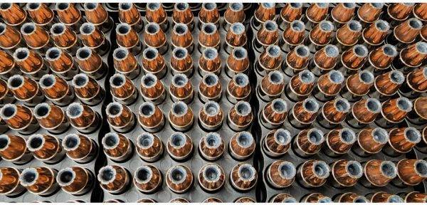 Loose 45 acp (automatic colt pistol) ammo in a pile with shiny clean shells.